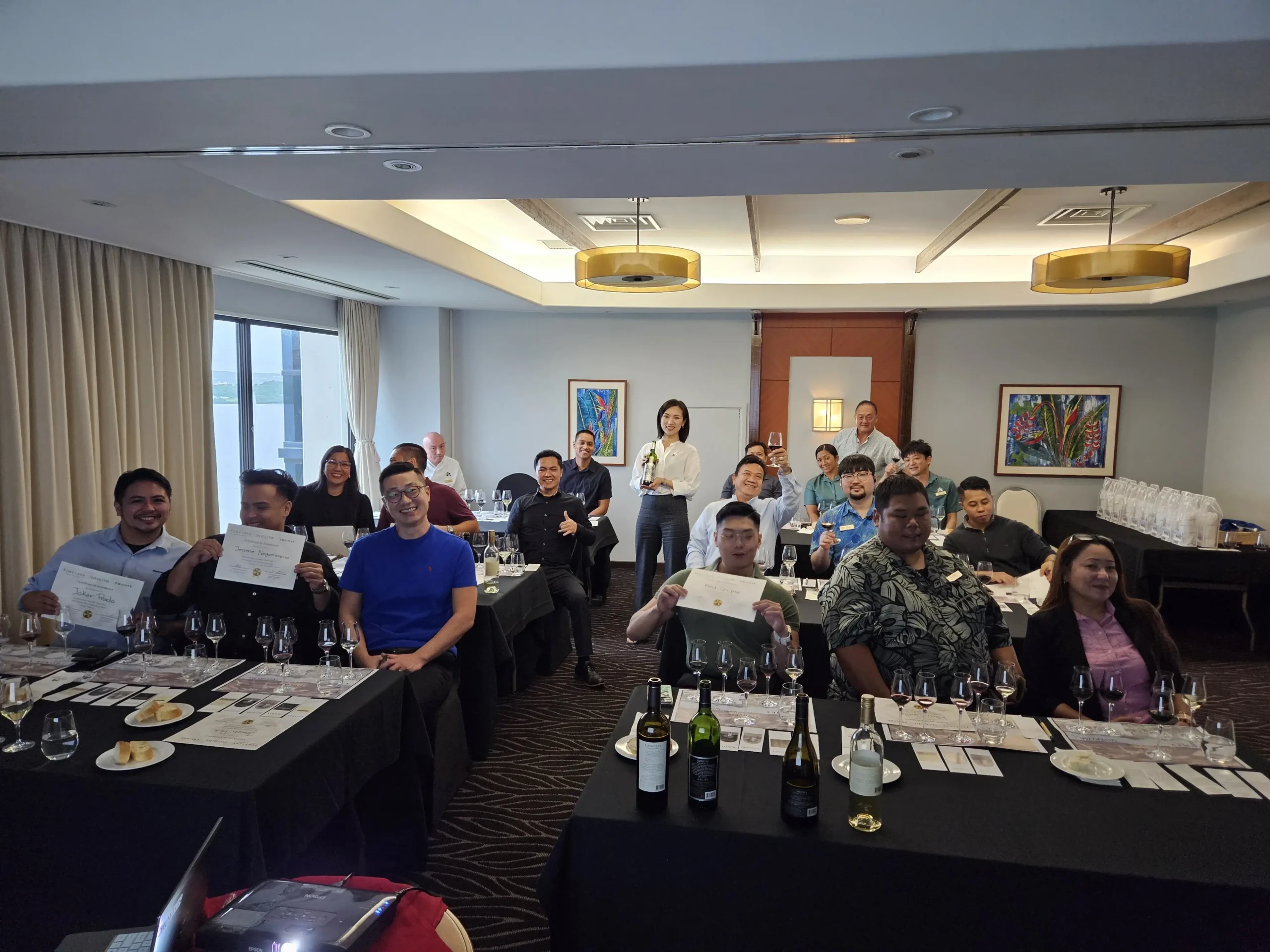 Photo of a group of people at a wine tasting event