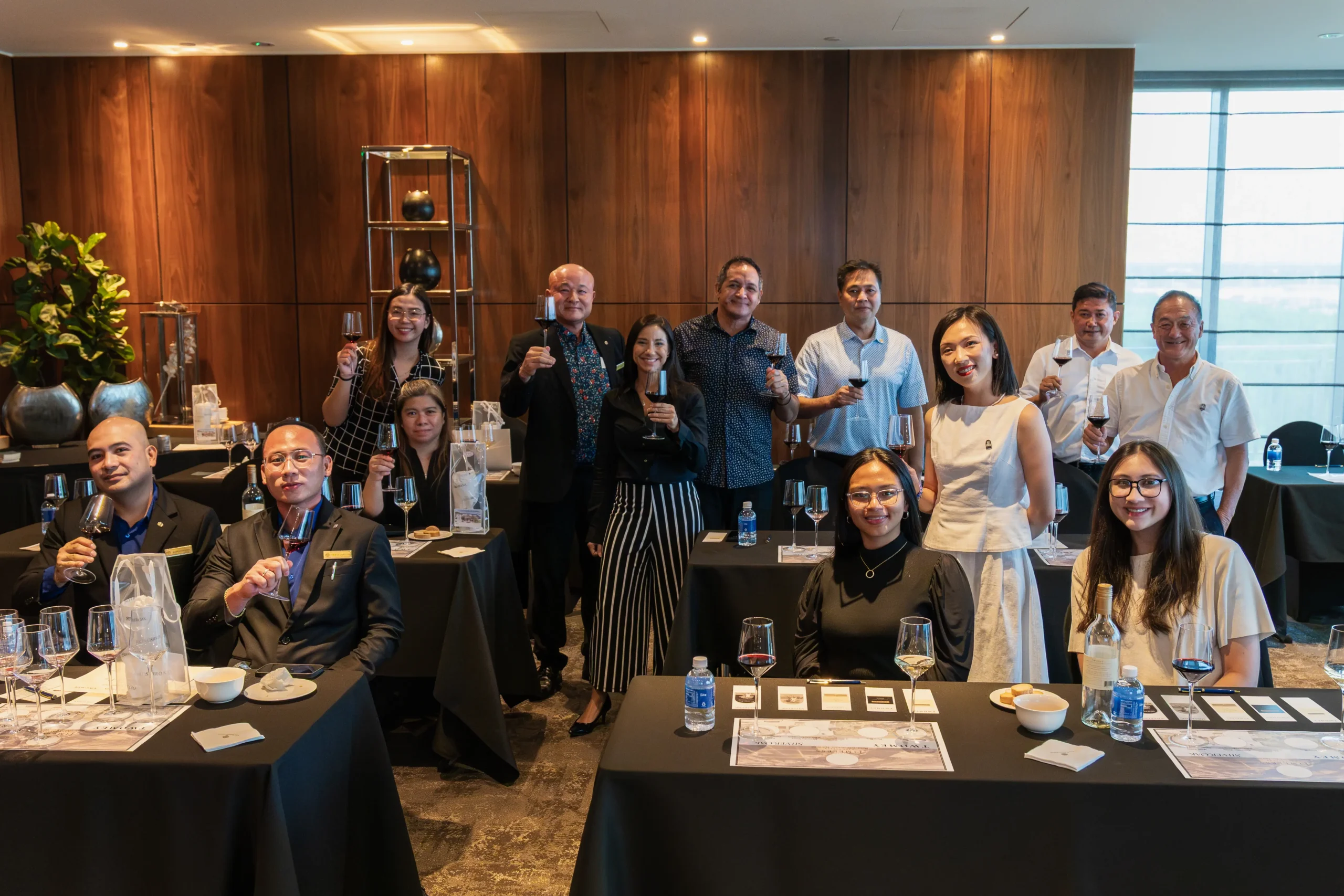 Photo of a group of people at a wine tasting event